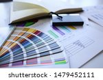 Small photo of Color print of pantone statistics offset organization gives customer an order products for distribution during promotion concept