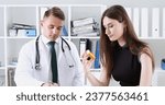Small photo of Handsome male doctor explain prescription while patient hand hold jar of pills. Panacea and life save prescribe antidepressant legal drug store vitamin aid give or take pills ward round concept