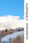 Small photo of Vertical frame Row of homes on pristine snowy slope with unobstructed view of Wasatch Mountains