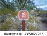 Small photo of Hiking trail signage at Sabino Canyon State Park in Tucson, Arizona. Signpost against the green shrubs and trails at the background.