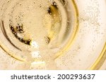 Many tiny bubbles in a champagne glass