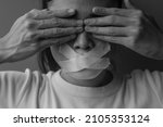 Small photo of woman with mouth sealed in adhesive tape. Free of speech, freedom of press, Human rights, Protest dictatorship, democracy, liberty, equality and fraternity concepts
