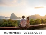 Small photo of Happy couple traveler enjoy Phang Nga bay view point, Tourists relaxing at Samet Nang She, near Phuket in Southern Thailand. Southeast Asia travel, trip, love, together and summer vacation concept