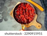 Small photo of homemade sundry tomato in the small stainless steel pan fry.