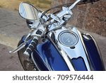 Small photo of road motorcycle in blue. Rul closeup