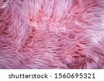Fashionable rose colour fur cloth texture. Pink fluffy fur, fashion background. 