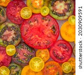 Small photo of Best Heirloom Tomato Varieties. Delicious Heirloom tomatoes sliced in half.