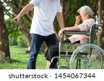 Small photo of Unhappy,problems asian family,angry man or male caregiver expelled his elderly woman in wheelchair quarrel,arguing,senior mother crying in outdoor,aggressive son,family,violence,ungrateful concept