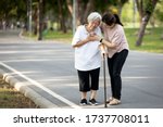 Small photo of Old elderly with short of breath and chest pain from heart disease, heart attack or heart failure while walking to exercise in outdoor at the park,senior woman with illness,symptoms of dyspnea,angina