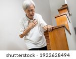 Small photo of Asian senior grandmother suffering from pain in chest with acute dyspnea or asthma disease,Tired old elderly eyes closed and hand hold her chest,difficulty breathing,shortness of breath,breathless