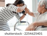 Small photo of Angry asian senior grandma with bad temper,Dissatisfied elderly woman attacking,pulling hair,fight quarrel between old people and female caregiver,concept of aggression,physical abuse,stop violence