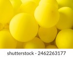 Group of yellow balloons create ...