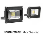 Small photo of Two Outdoor 10W And 20W Waterproof RGB LED Floodlights Or Lawn Light, Or landscape Light Isolated On White Background, Close Up