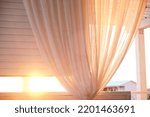 curtains and sunlight at sunset