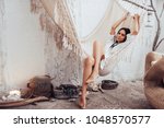 Attractive young woman is relaxing in spa and wellness center while lying in hammock. Beauty treatment concept.