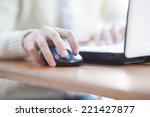 Closeup of woman hand clicking mouse outdoor