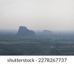 Mountains in fog at beautiful autumn in phitsanulok Thailand. Fog mountain valley, low clouds, forest, colorful sky with. pine trees in spruce foggy forest.selective focus.