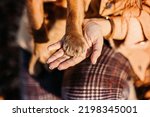 Small photo of Dog paws with human hands close up. Woman walk with little English cocker spaniel puppy dog in autumn park. Pet love, friendship, trust, help between the owner and dog.