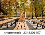 Small photo of Autumn wellbeing, protect mental health concept. How to Cope With Fall Anxiety. Beautiful black woman. Portrait of beautiful redhead woman in glasses on fall autumn tree background