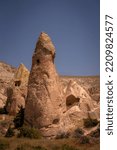 Small photo of Phallic shaped rock formation known as fairy chimney in Rose valley, caused by volcanoes, near Goreme, Cappadocia, Anatolia, Turkey
