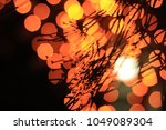 orange bokeh branches | Shutterstock . vector #1049089304
