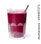Small photo of Closeup of fresh beetroot smoothie with green sappy leaf of mint isolated on a white background.