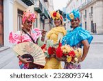 Small photo of Cuban women called canasteras with habano flowers and typical costume in La Havana, Afro caribbean people in Latin America