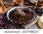 Small photo of mole poblano is sauce with chicken mexican traditional food in Mexico Latin America