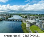 Small photo of Aerial view of Limerick city and King John's castle on King's Island with concentric walls and round towers along the Shannon river and Thomond bridge