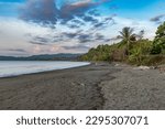 Small photo of DRAKE BAY, COSTA RICA-MARCH 11, 2017: Tourists on the beach in the small town of Drake Bay, Puntarenas, Costa Rica
