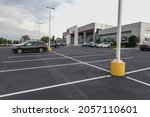 Small photo of Mt. Laurel, New Jersey - September, 2021: A Toyota dealership with its parking lot almost empty do to a shortage of materials to make manufacture new cars