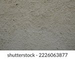 Small photo of background old raw exterior beige roughcast wall facade home concrete seamless painted texture