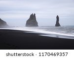 Stormy, moody day on black sand beach Reynisfjara on the south of Iceland, Europe, huge waves on Atlantic Ocean