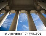 Building column on a government building with a beautiful blue sky.