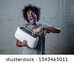 Small photo of Domestic accidents and electricity danger. Young man electrocuted trying to get toast out of toaster with knife. Husband screaming as getting an electric shock with dirty burnt funny face expression.