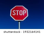 A Traffic Stop Sign And Blue Sky