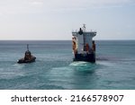 Small photo of Bridgetown, Barbados - 26 March 2022: The Cargo Ship CFS Horizon leaves Bridgetown harbour escorted by a Tug boat, as seen from