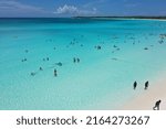Small photo of Bahamas Half Moon Cay May 2022 Beachcomber tourist enjoying a day at the beach.