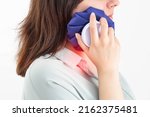 Small photo of A girl attaches a medical bag with cold to the swelling on her cheek after removing a wisdom tooth. Concept for pain relief and inflammation in dentistry with the help of cold, pulpitis