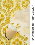Small photo of Vintage Background with old yellow wall paper and raspy wooden surface