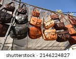 Leather bags for sale at a market stall
