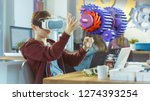 Small photo of In a Computer Science Class Boy Wearing Virtual Reality Headset Works in Interactive 3D Environment. Mechanical Modeling Project of Connecting Gears with Augmented Reality Software.