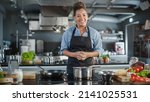 Small photo of TV Cooking Show in Restaurant Kitchen: Portrait of Black Female Chef Talks, Teaches How to Cook Food. Online Courses, Streaming Service, Learning Video Lectures. Healthy Dish Recipe Preparation