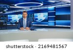 Small photo of Beginning Evening News TV Program: Anchor Presenter Reporting on Business, Economy, Science, Politics. Television Cable Channel Anchorman Talks. Broadcast Network Newsroom Studio.