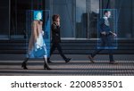 Small photo of Crowd of Business People Tracked with Advanced Technology Walking on Busy Urban City Streets. CCTV AI Facial Recognition Big Data Analysis Interface Scanning, Showing Important Personal Information.