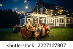 Small photo of Group of Multiethnic Diverse People Having Fun, Sharing Stories with Each Other and Eating at Outdoors Dinner Party. Family and Friends Gathered Outside Their Home on a Warm Summer Evening.