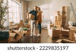 Small photo of Family New Home Moving in: Happy and Excited Young Couple Enter Newly Purchased Apartment. Beautiful Family Happily Embracing, Imagining Future. Modern Home Ready for Decorations