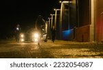 Small photo of Two Police Officers in Pursuit of a Suspect. Cops Getting out of the Car Start Chasing Criminal on Foot Through the Dark City Streets. Heroic Officers Catching and Arresting Drug Dealer, Murdered