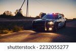 Small photo of Highway Traffic Patrol Car In Pursuit of Criminal Vehicle. Police Officers in Squad Car Chase Suspect on Industrial Area Road. Cinematic Atmospheric High Speed Action Scene
