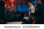 Small photo of Two Police Officers Arrest Suspect, Put Him in Patrol Сar. Officers of the Law Handcuff Dangerous Criminal on Dark City Street. Cops Arresting Felon, Fight Crime. Cinematic Documentary